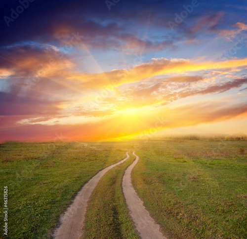 Fototapeta path in steppe to sunset