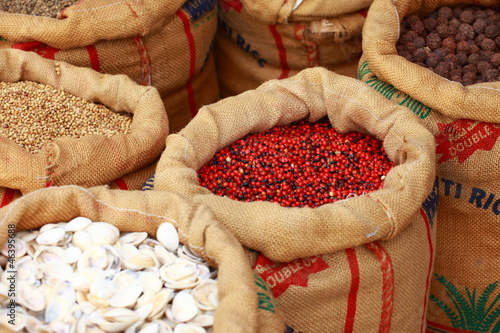 Fototapeta Traditional spices and dry fruits in local bazaar in India.