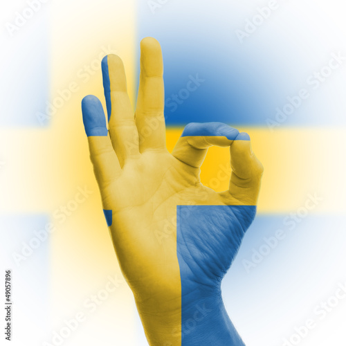 Lacobel hand OK sign with Swedish flag