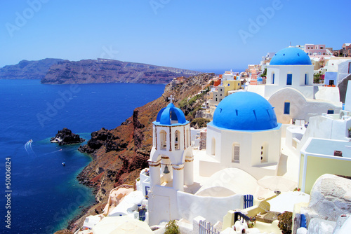 Fototapeta Blue and white churches of Oia village, Santorini, Greece