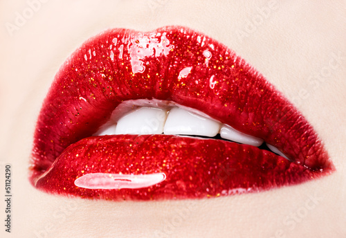 Fototapeta Beautiful female with red shiny lips closeup