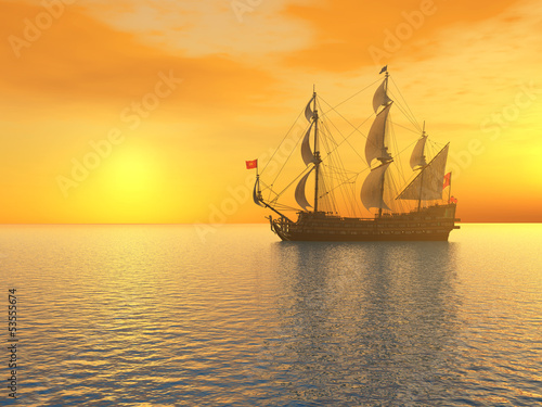 Fototapeta Segelschiff vor einem Sonnenuntergang