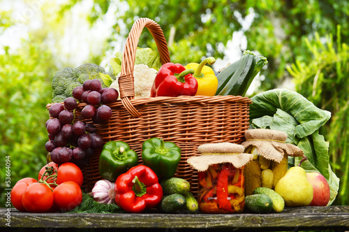  Fresh organic vegetables in wicker basket in the garden