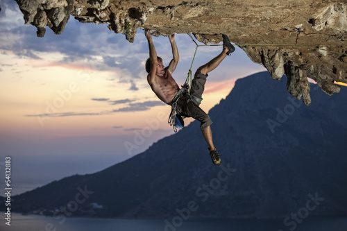 Fototapeta Rock climber at sunset, Kalymnos Island, Greece
