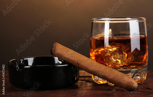 Fototapeta Brandy glass with ice and cigar