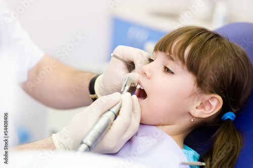  close-up medical dentist procedure of teeth polishing 
