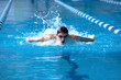Swimmer in waterpool swim one of swimming style