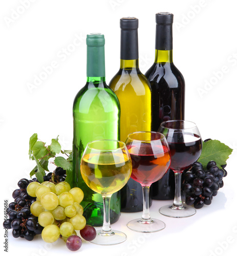 Lacobel bottles and glasses of wine and assortment of grapes, isolated