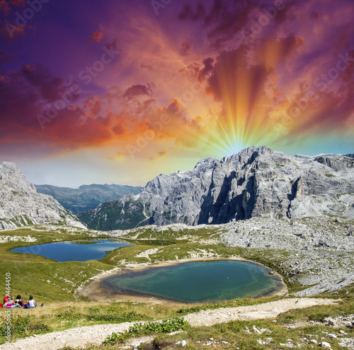 Fototapeta Beautiful lakes and peaks of Dolomites. Summer sunset over Alps