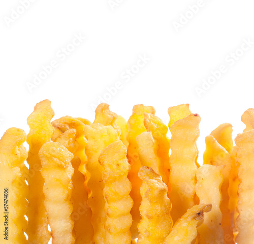 Fototapeta Crinkle cut golden potato chips