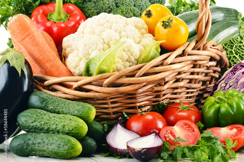  Variety of fresh organic vegetables in wicker basket
