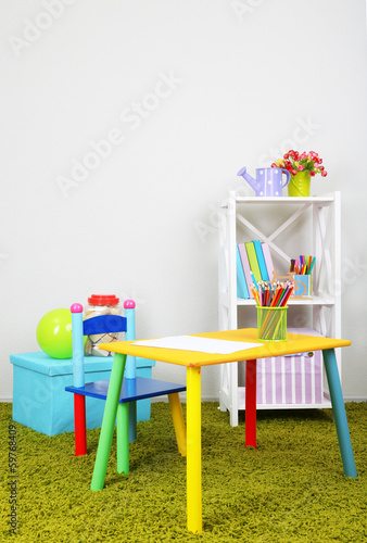  Small and colorful table and chair in room
