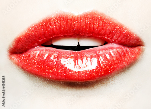  Beautiful female with red shiny lips close up