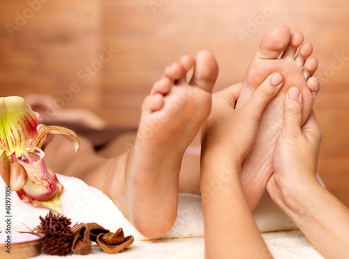 Fototapeta Massage of human foot in spa salon