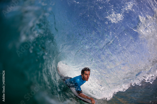 Fototapeta Surfing Bodyboarder Inside Hollow Wave