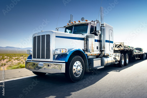 Fototapeta Truck and highway at day - transportation background