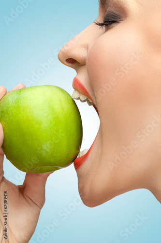  Biting apple.