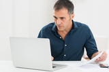 Mature Man Working At The Computer