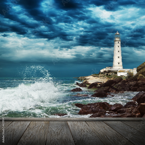  Big ocean wave, lighthouse and wood pier