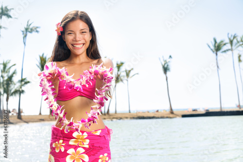 Fototapeta Hawaii woman showing flower lei garland