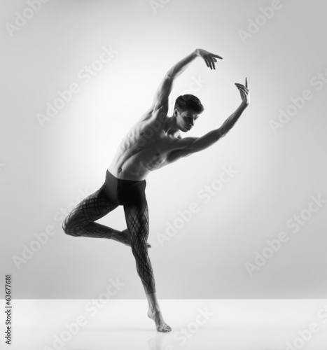 Fototapeta A handsome, sporty and athletic ballet dance