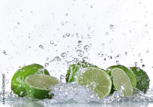 Limes with water splash