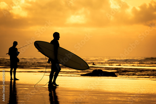  surfer silhouette during sunset
