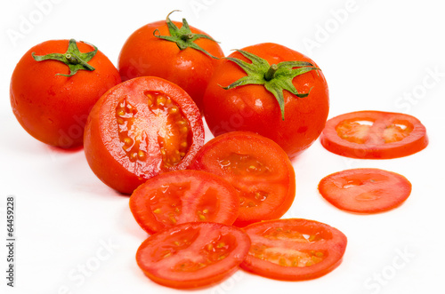 Fototapeta Tomatoes With Slices on White