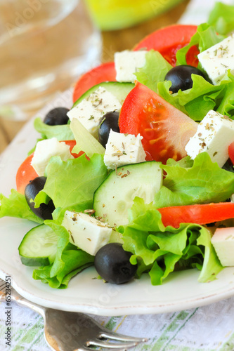  Greek salad with feta and fresh vegetables served on a plate