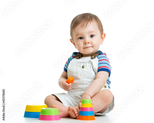  kid boy playing with toy isolated on white background