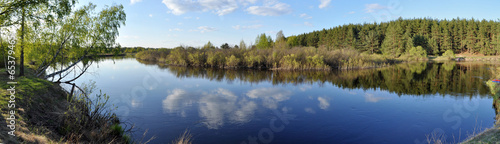 Fototapeta May panorama quiet forested river.