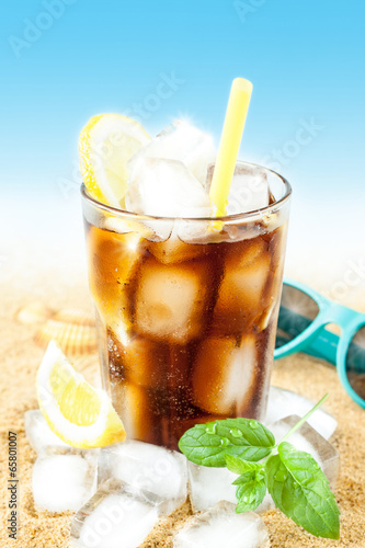  Cold cola or ice tea with lemon on beach
