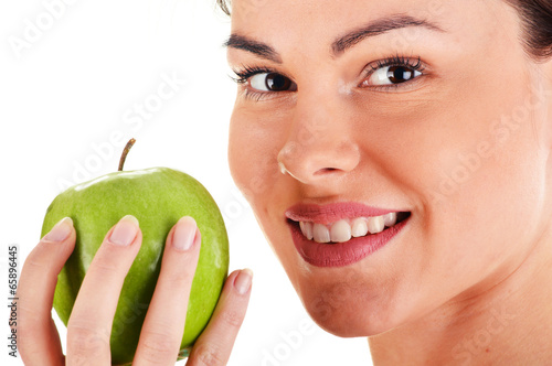  Portrait of young woman holding apple isolated on white