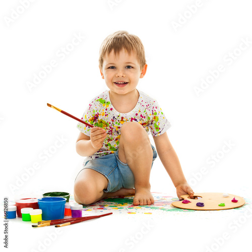  Smiling little boy painting