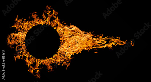 Fototapeta fireball with circle frame isolated on black