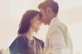 Loving couple in the park. Vintage retro style with light leaks poster