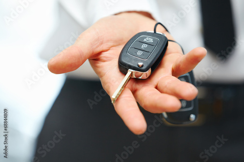 Car Keys. Seller hand giving keys poster