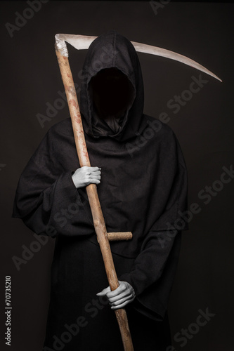 Poster Angel of death with a scythe in his hands on black background