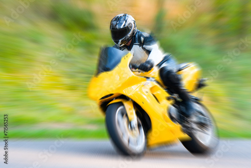 Fototapeta Motorcyclist in motion blur