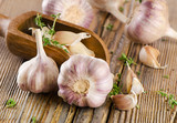 garlic  on  a wooden board poster