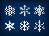white snowflakes on dark blue background poster