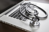 Medical Stethoscope Resting on Laptop Computer poster