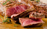 Beef  steak on   cutting board. poster
