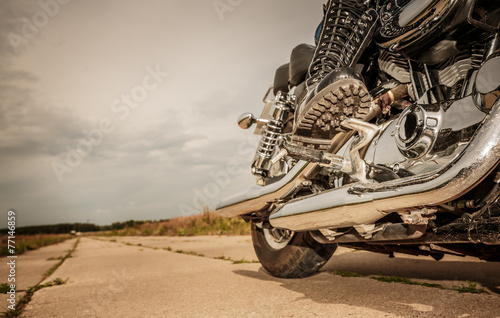 Fototapeta Biker girl riding on a motorcycle