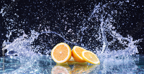 Macro water splash on lemon. Water drops with juicy lemon © dmitry_dmg