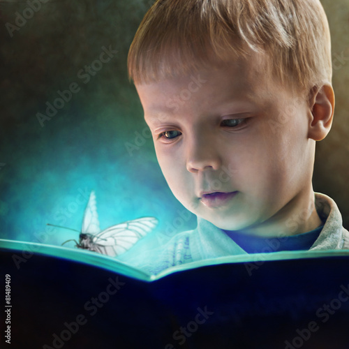 child reading a <b>magic book</b> - 500_F_81489409_JGN3uGDc9M61Y5fapa1Y3Z9JT7Nzqrpz