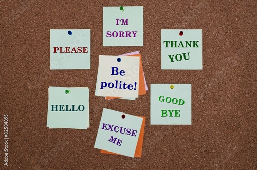 Be polite advice on paper notes fixed on cork board