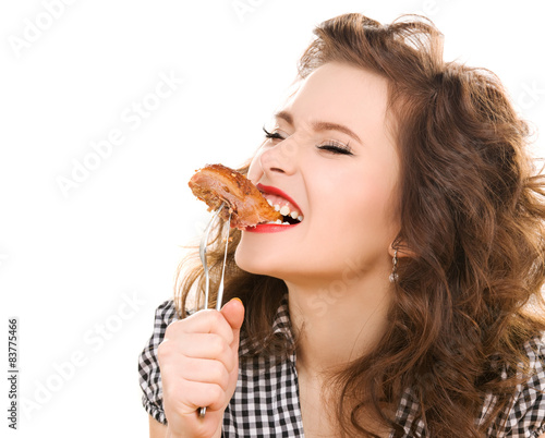 paleo diet concept - woman eating meat