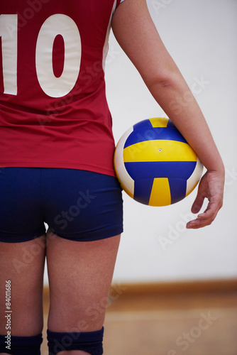 volleyball woman jump and kick ball isolated on white background Poster