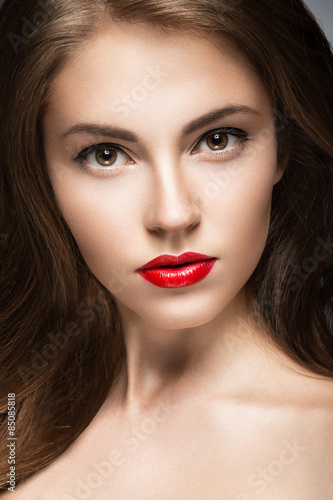 Poster Beautiful woman with evening make-up, red lips and curls